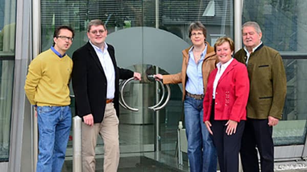Krippner family in front of the company building