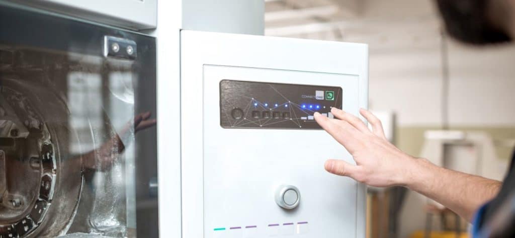 Membrane keypad with metal optics built into machine