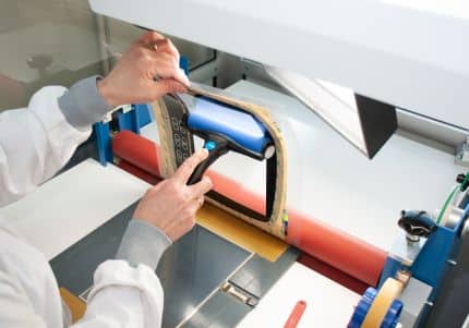 Woman cleans foil with roller