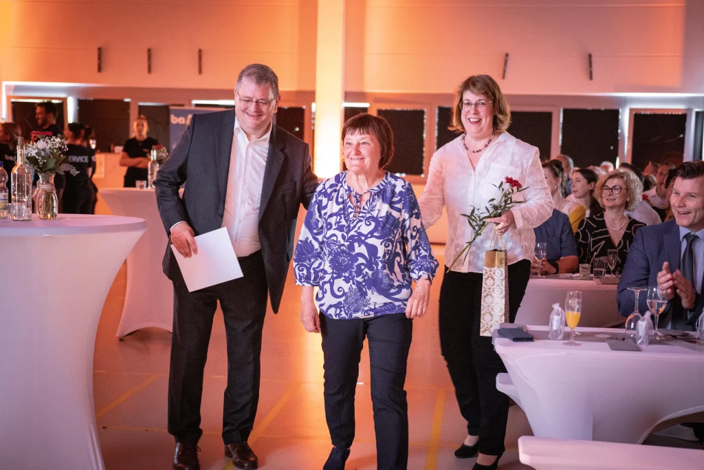 Mr. and Mrs. Krippner with Mrs. Kaiser during the presentation of the certificate for their 40th anniversary at H+K.