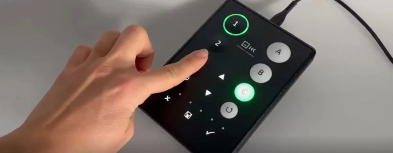 Hand presses buttons on the Tactile Key pattern
