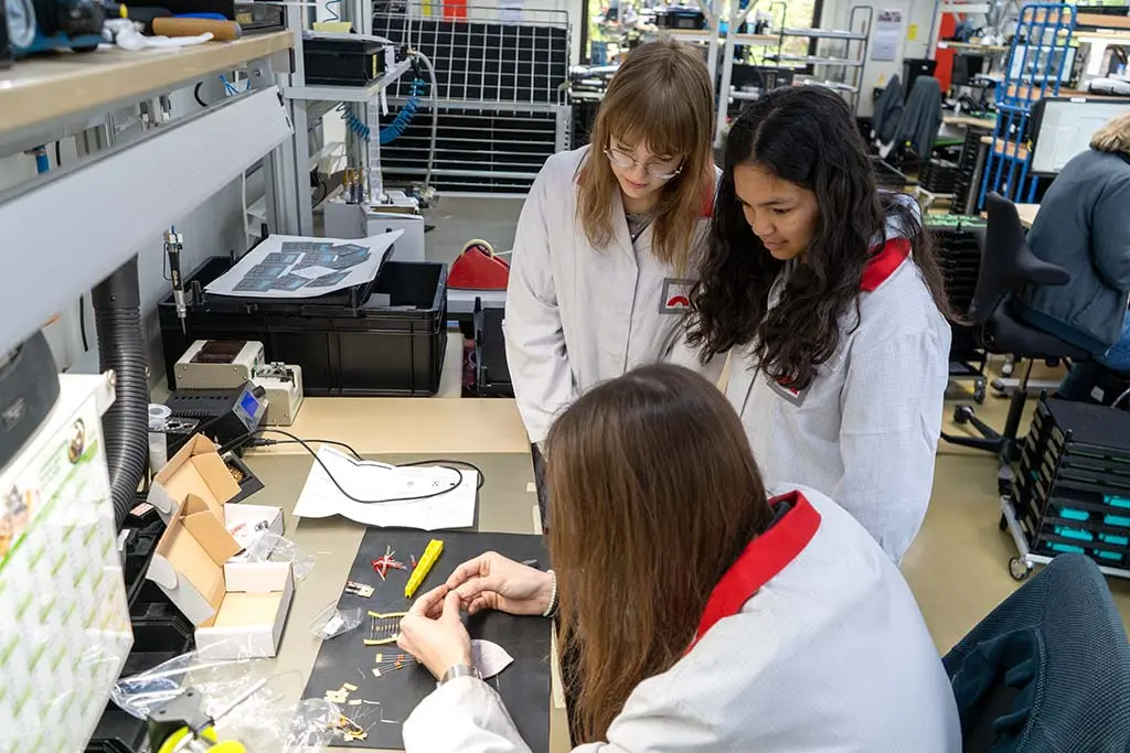 Two girls soldering on Girls' Day