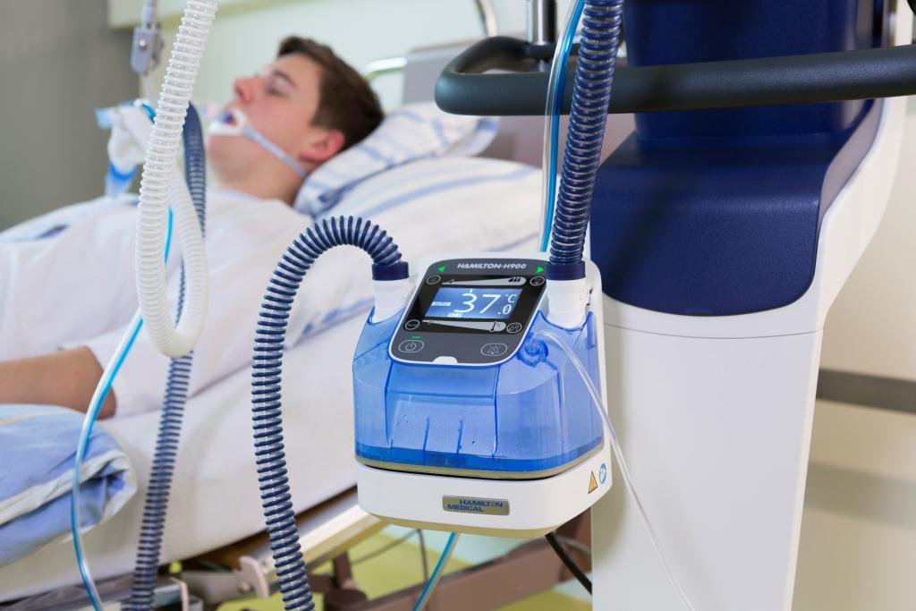 Patient in intensive care unit with ventilator
