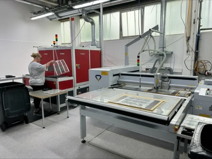 Employee operates a laser machine