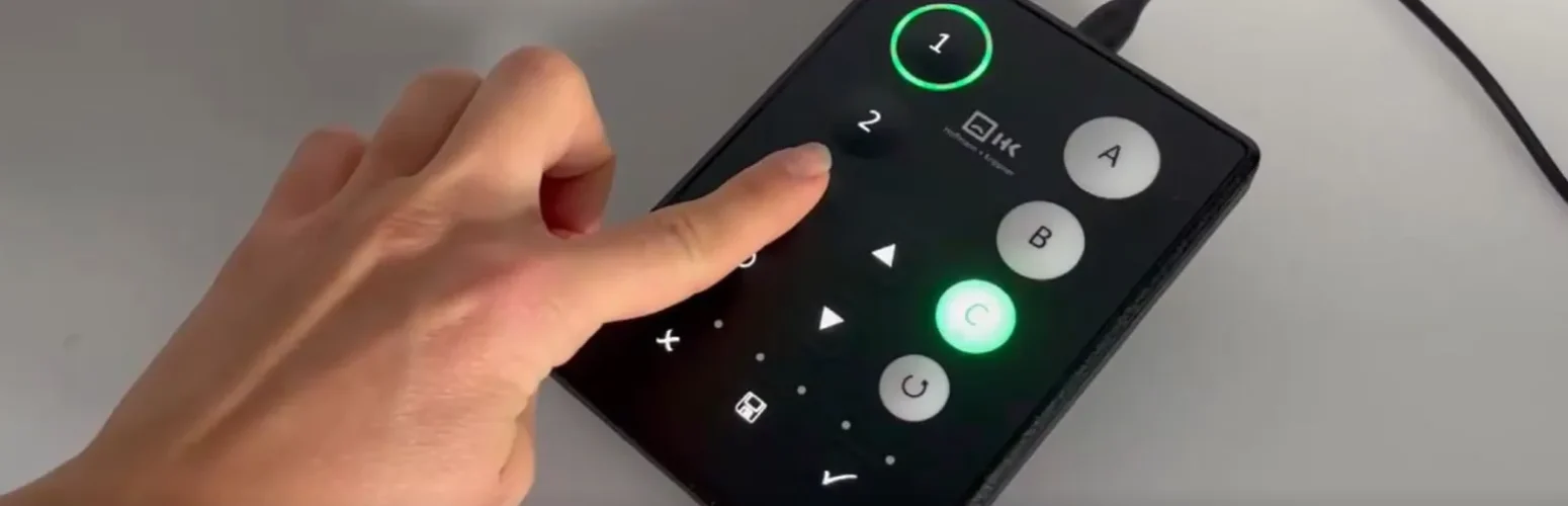 Hand presses buttons on the Tactile Key pattern